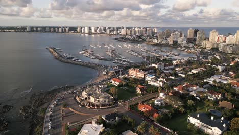Sunlit-Punta-del-Este-coastline-waterfront-skyscraper-resort-city-landscape-Uruguay-skyline-aerial-view