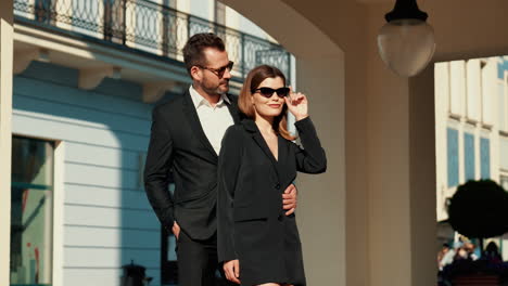 stylish couple in black suits