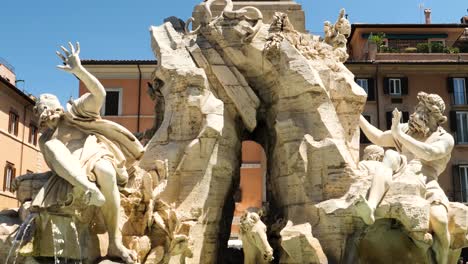 Allegories-of-the-Fountain-of-the-Four-Rivers-in-Piazza-Navona,-Rome,-Italy