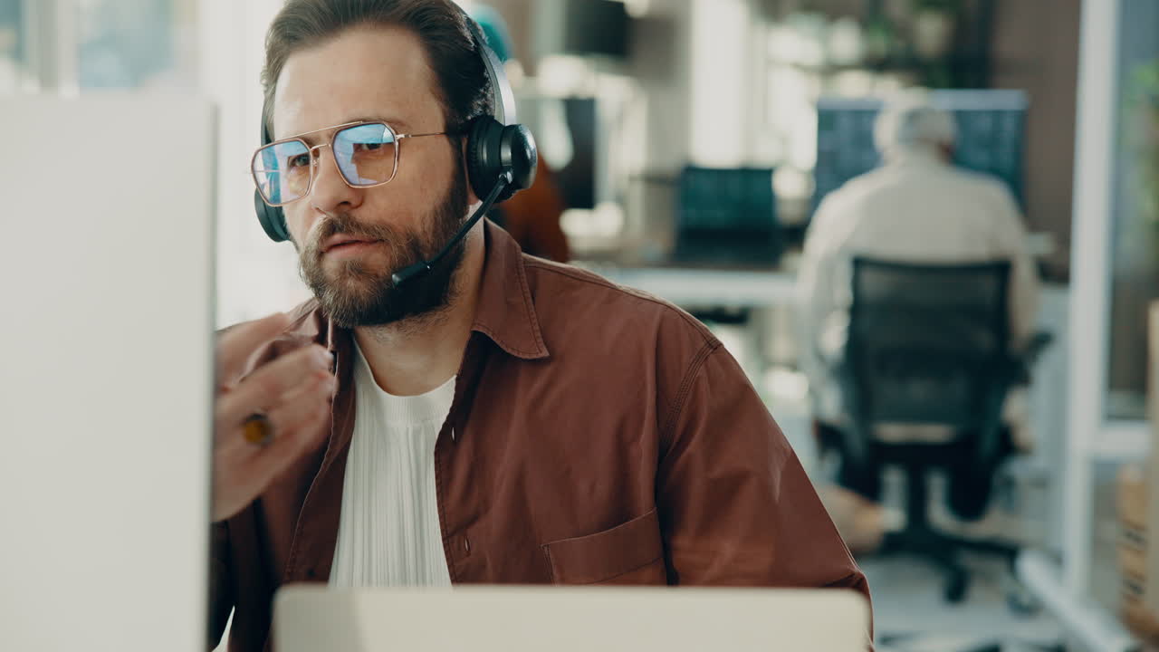 Man with headset working in office