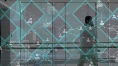 red de iconos de perfiles contra un médico caucásico hablando en teléfono inteligente en el hospital