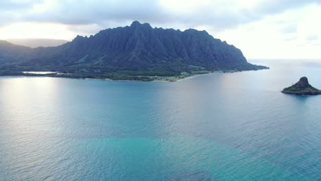 descending aerial shot of chinamans hat island in oahu, hawaii