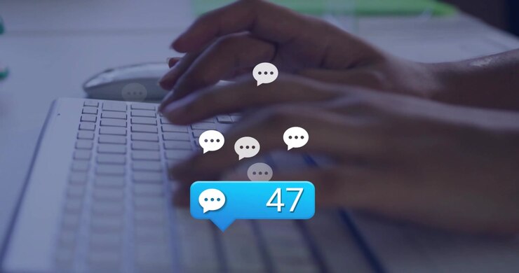 Woman typing on white keyboard, initiating messaging badge rising as icons clustering above hands