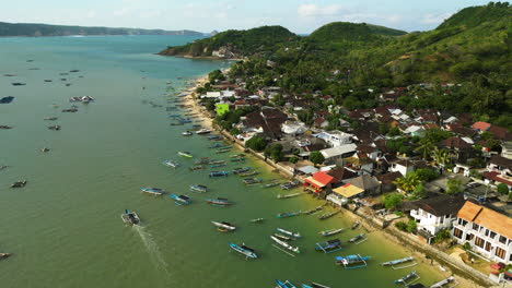 aerial view of seaweed, lobster and fish farms in the muslim fisherman village of gerupuk surrounded by mountains and sea, lombok, indonesia