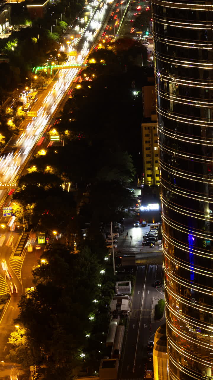 Timelapse of the Beijing city skyline from a high vantage point in vertical at night