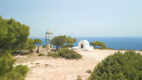 Mediterranean-Shrubs-and-Trees-by-the-Rugged-Path-of-the-Agios-Mammas-Chapel,-Kos,-Greece-Reveal-Shot