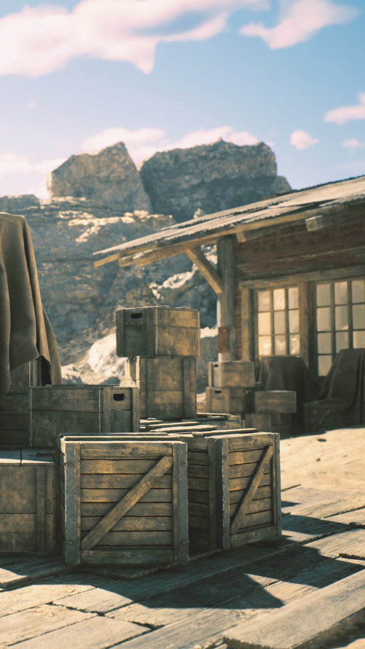 Weathered crates and rustic cabin nestled in rocky landscape under clear sky
