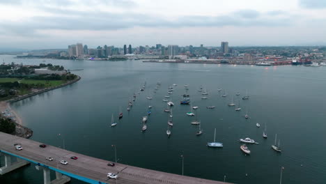 Cinematic-aerial-landscape-of-Coronado-Bridge-and-boats-at-San-Diego-bay