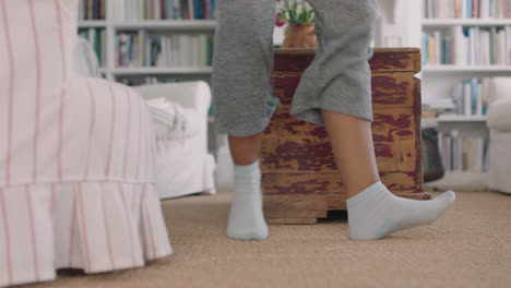 close-up-feet-happy-woman-dancing-at-home-having-fun-celebrating-weekend-morning-with-funky-dance-moves-wearing-socks-enjoying-freedom-4k-footage