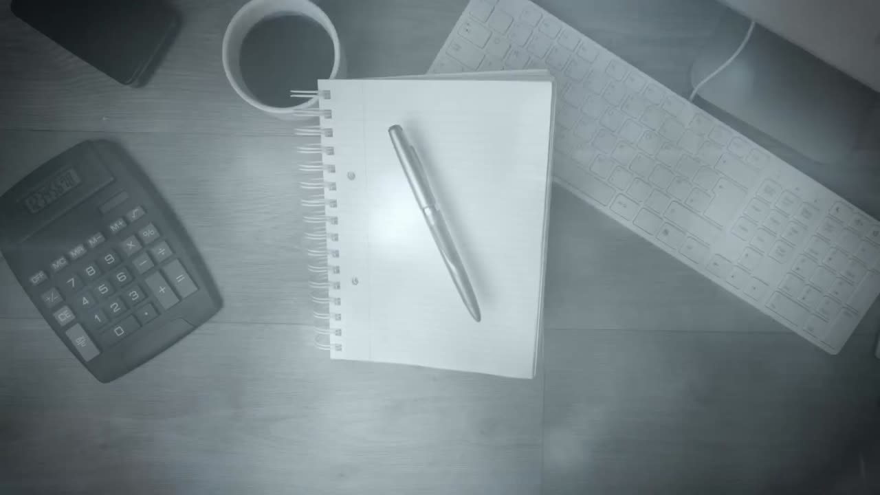 Animation of lights over notepad, calculator and keyboard on desk