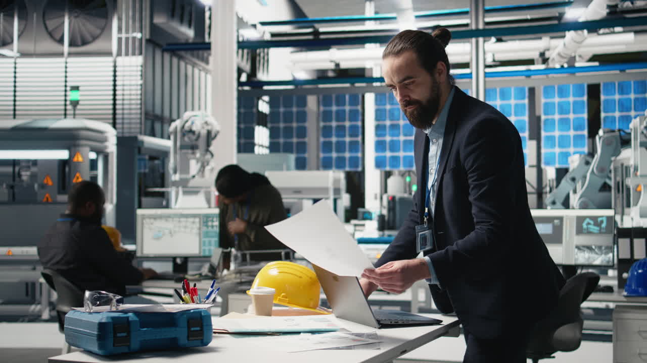 Engineers working in a robotics factory