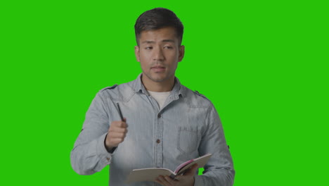 male teacher talking to school university or college class in lesson against green screen 2