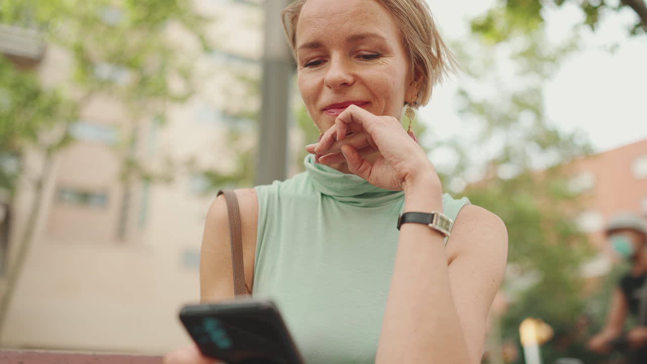 Woman using smartphone outdoors