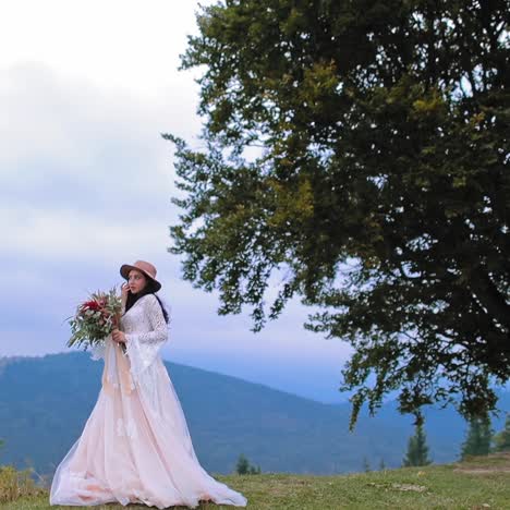 . Beautiful bride on mountain. Wedding shot of young bride at mountains with amazing view