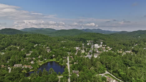 highlands north carolina aerial v16 cinematic drone reverse flyover capturing quaint town, harris lake, lush green forests and rolling mountain landscape views - shot with mavic 3 cine - july 2022