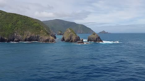 sailing past some islands at the top of the south island of new zealand