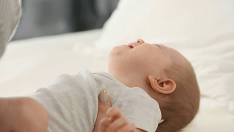 young mummy consoling crying baby girl