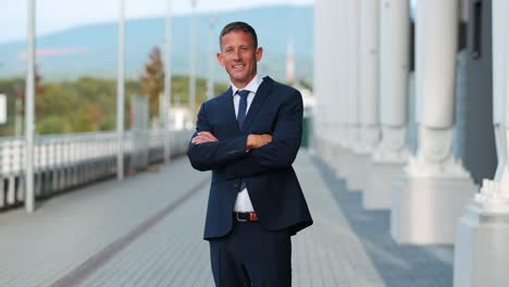 medium-shot-of-a-mature-middle-aged-businessman-smiling-at-the-camera