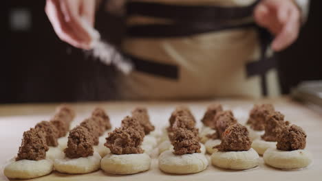 a professional baker makes dumplings with meat filling. delicious traditional ukrainian cuisine