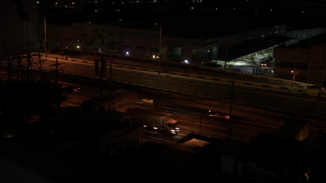 high angle mid shot of various vehicle passing by in a highway in manila philippines