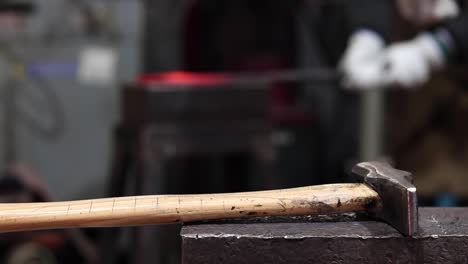 metal tools on anvil in blacksmith workshop