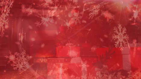 Snowflakes-falling-over-Christmas-presents-against-white-background