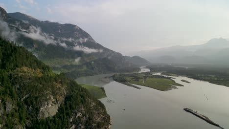 arial pan of squamish river opening into howe sound, squamish, bc, canada