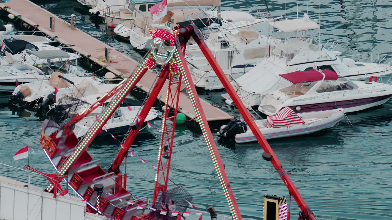 Aerial view of the Port Hercule Funfair in Monaco in daylight