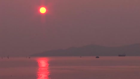 smoke in sky with red sun. forest fire smoke