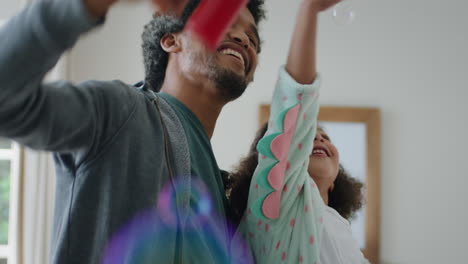 adorable little girl playing with soap bubbles at home mother and father having fun with child at enjoying family time on weekend 4k