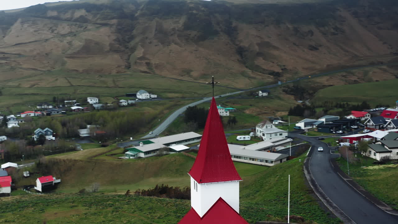 Aerial drone shot of local Church in V&iacute;k &iacute; M&yacute;rdal, South Iceland