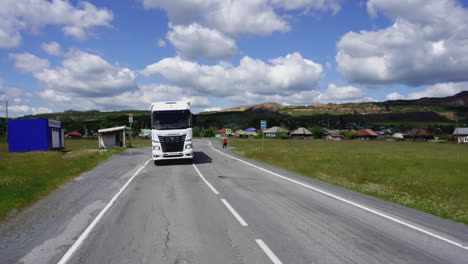 truck driving on a country road