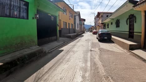 driving through a colorful town in mexico