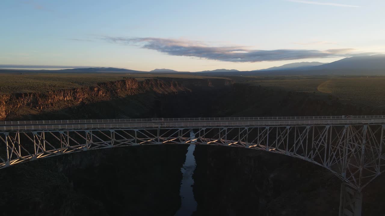 Aerial View of a Bridge Over a Canyon at Sunset