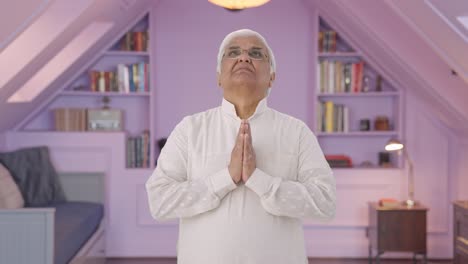 Religious-Indian-old-man-praying-to-God