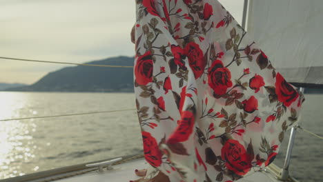 woman in a floral dress on a yacht