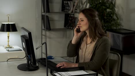 female office worker happily types getting her work done