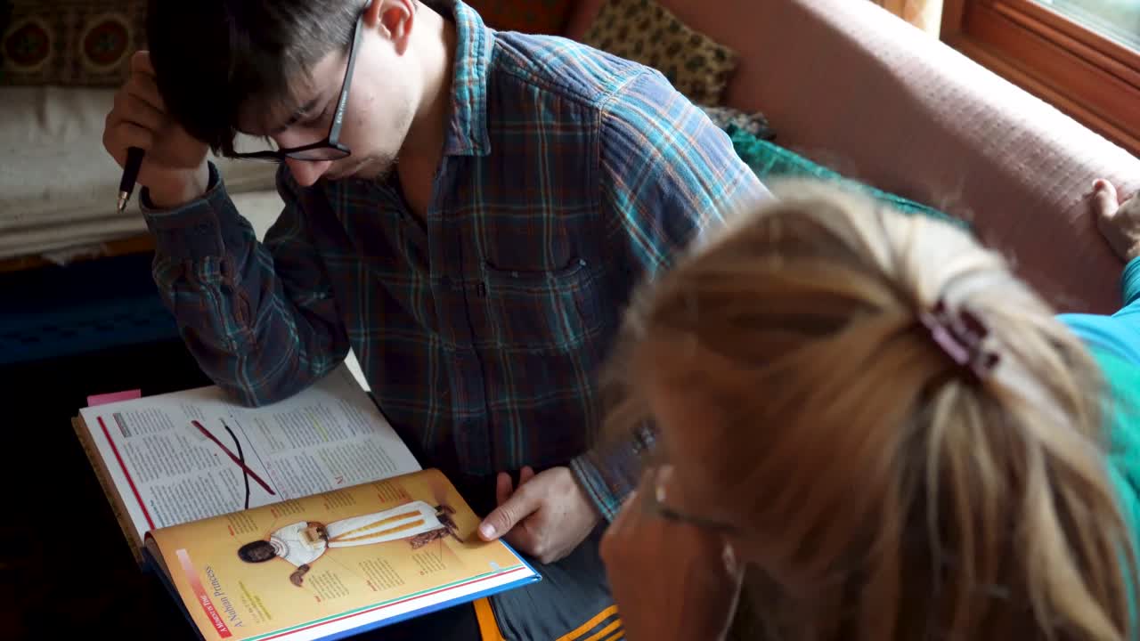 People Reading and Studying a Textbook