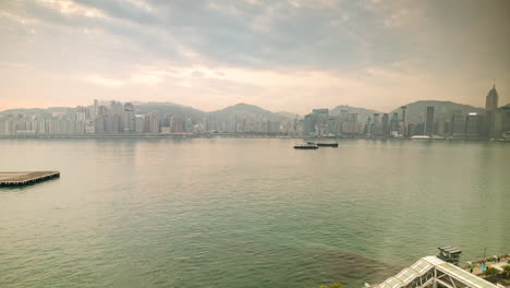 hong kong - 19 march 2025 : hong kong central skyline timelapse filmed from across the harbour in kowloon