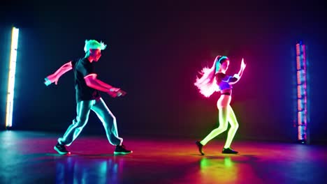 couple performing neon dance routine