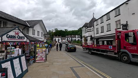 shops and vehicles on a bustling street