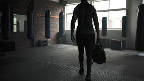 gym, walking and fitness of a man with a bag to