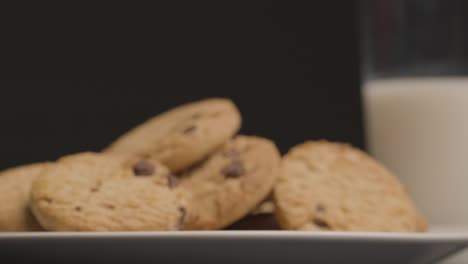 Sliding-Shot-Approaching-Chocolate-Chip-Cookies-On-Plate-