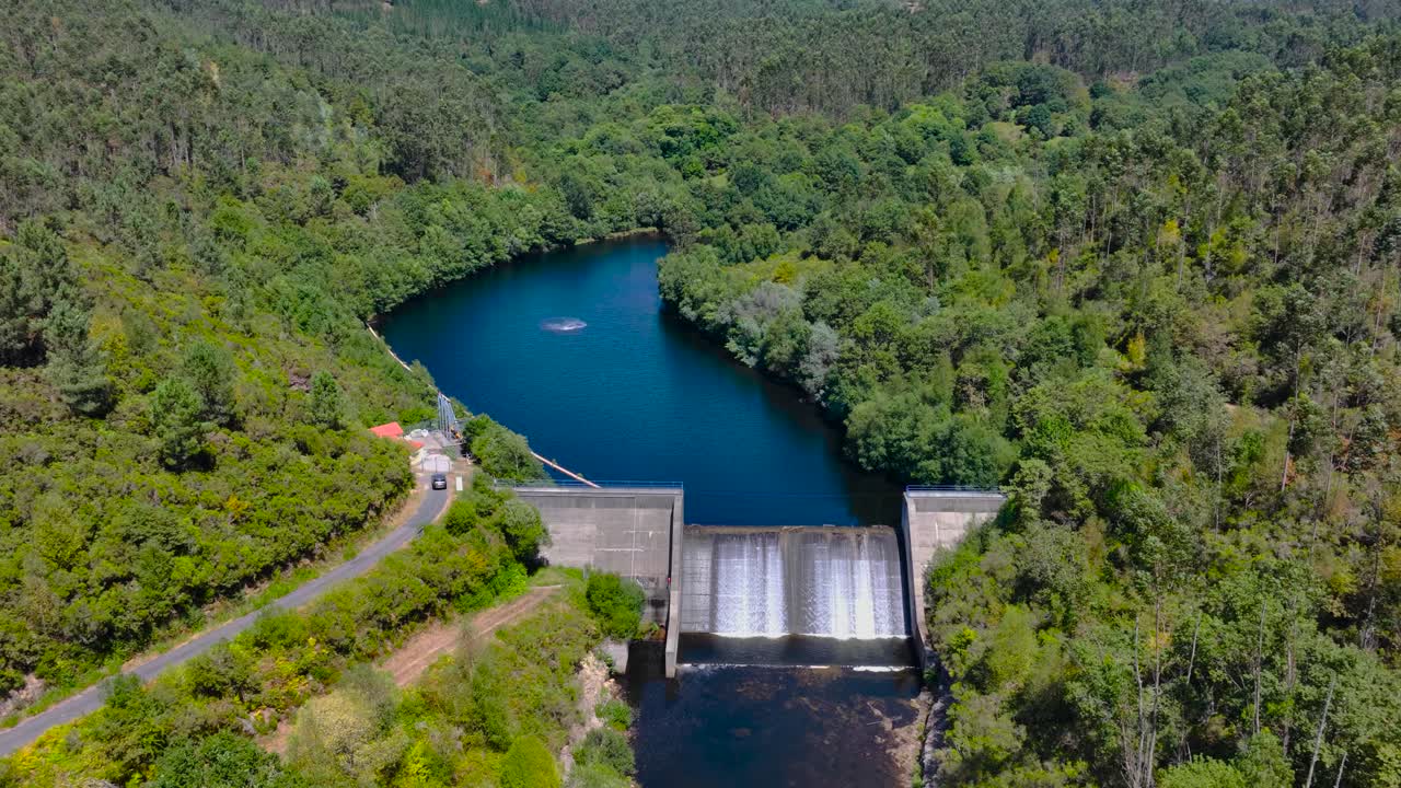 Above View Of Rio Lérez Dam Flowing Through Campo Lameiro In Galicia, Spain. Aerial Drone Shot