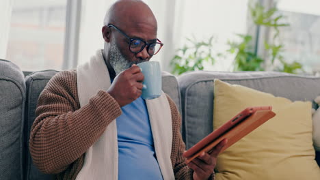Coffee,-tablet-and-senior-man-on-a-sofa
