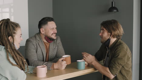 office colleagues chatting and laughing
