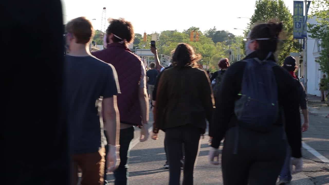 Dynamic selective focus shot of Black Lives Matter protest marchers