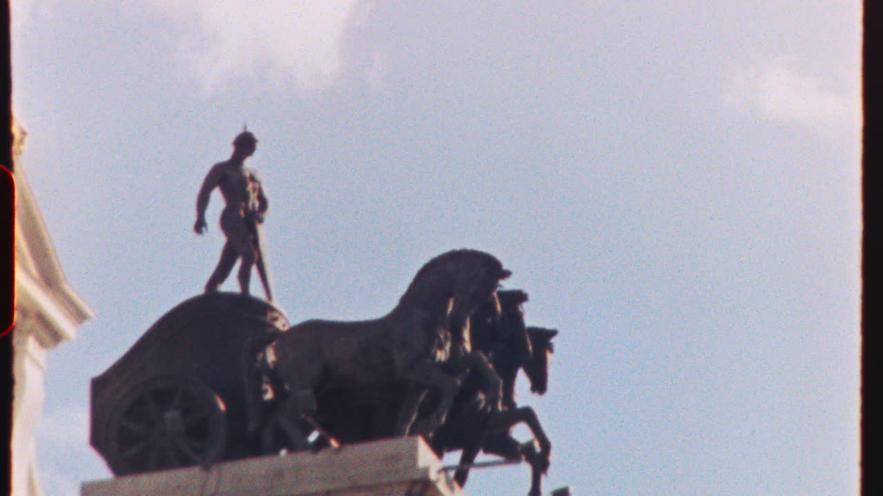 MADRID, SPAIN - JULY 21, 2025: Vintage toned quadriga sculpture adorning Cibeles Fountain facade, Bank of Spain landmark, Madrid cityscape against azure sky with billowing clouds, captured on analog 8mm film