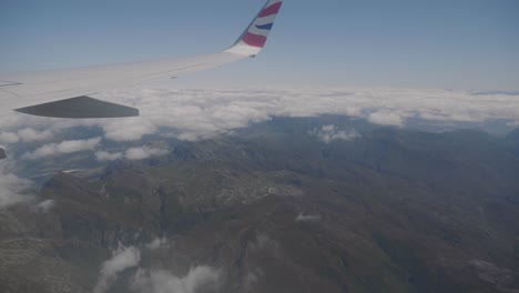 spectacular view from airplane window overlooking the western cape with mountains and clouds in the background in south africa.