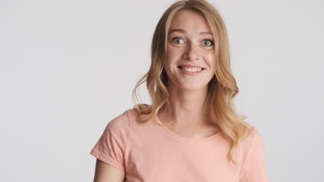 caucasian woman winking on camera.